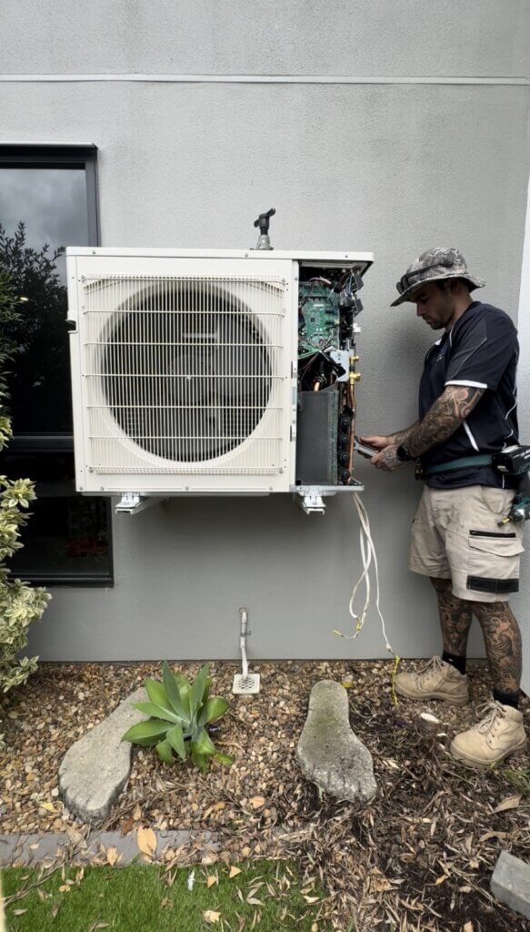 Licensed HVAC technician flaring and fitting refrigerant pipework to Mitsubishi Electric multi split air conditioning system