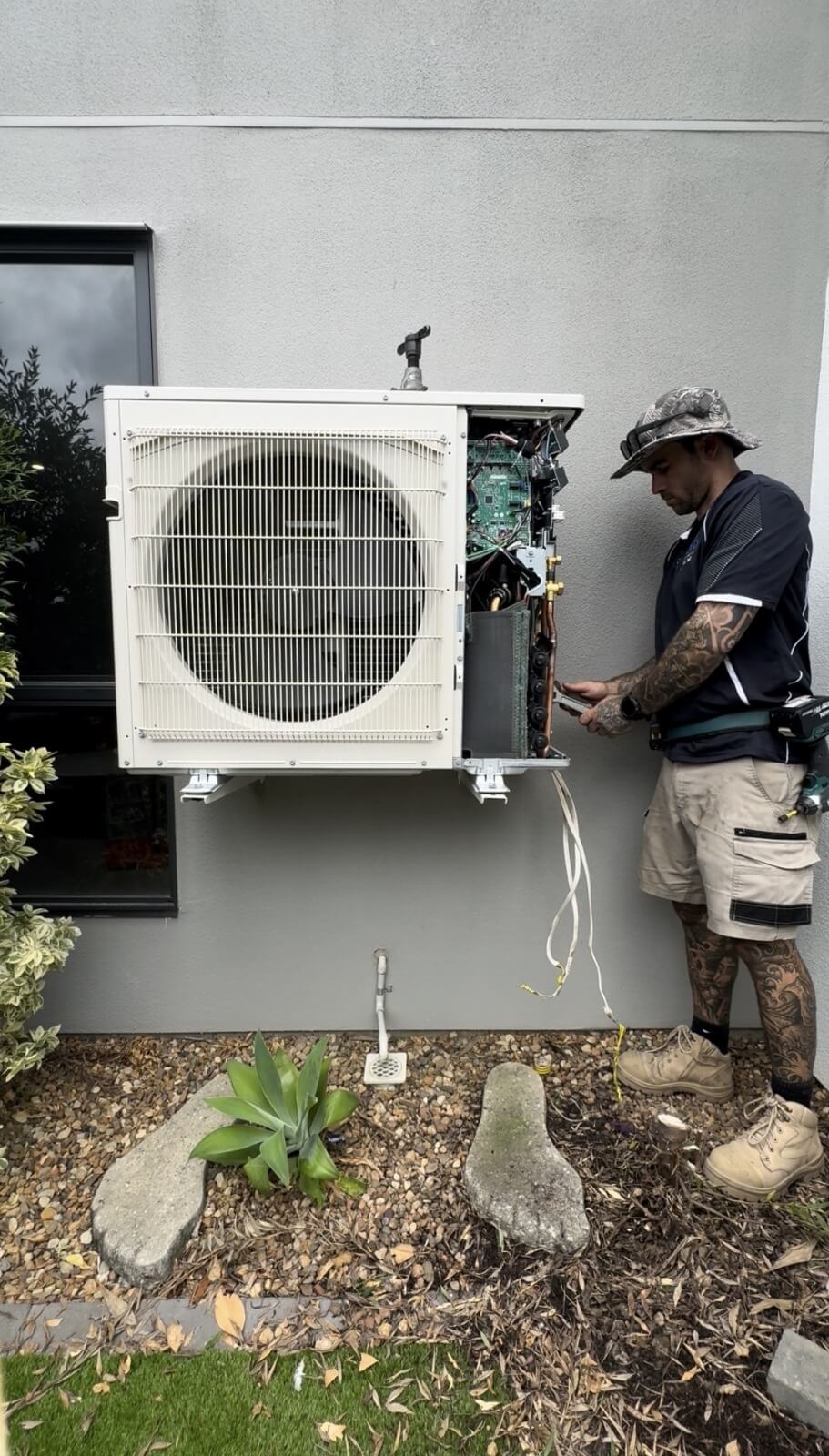 Licensed HVAC technician flaring and fitting refrigerant pipework to Mitsubishi Electric multi split air conditioning system